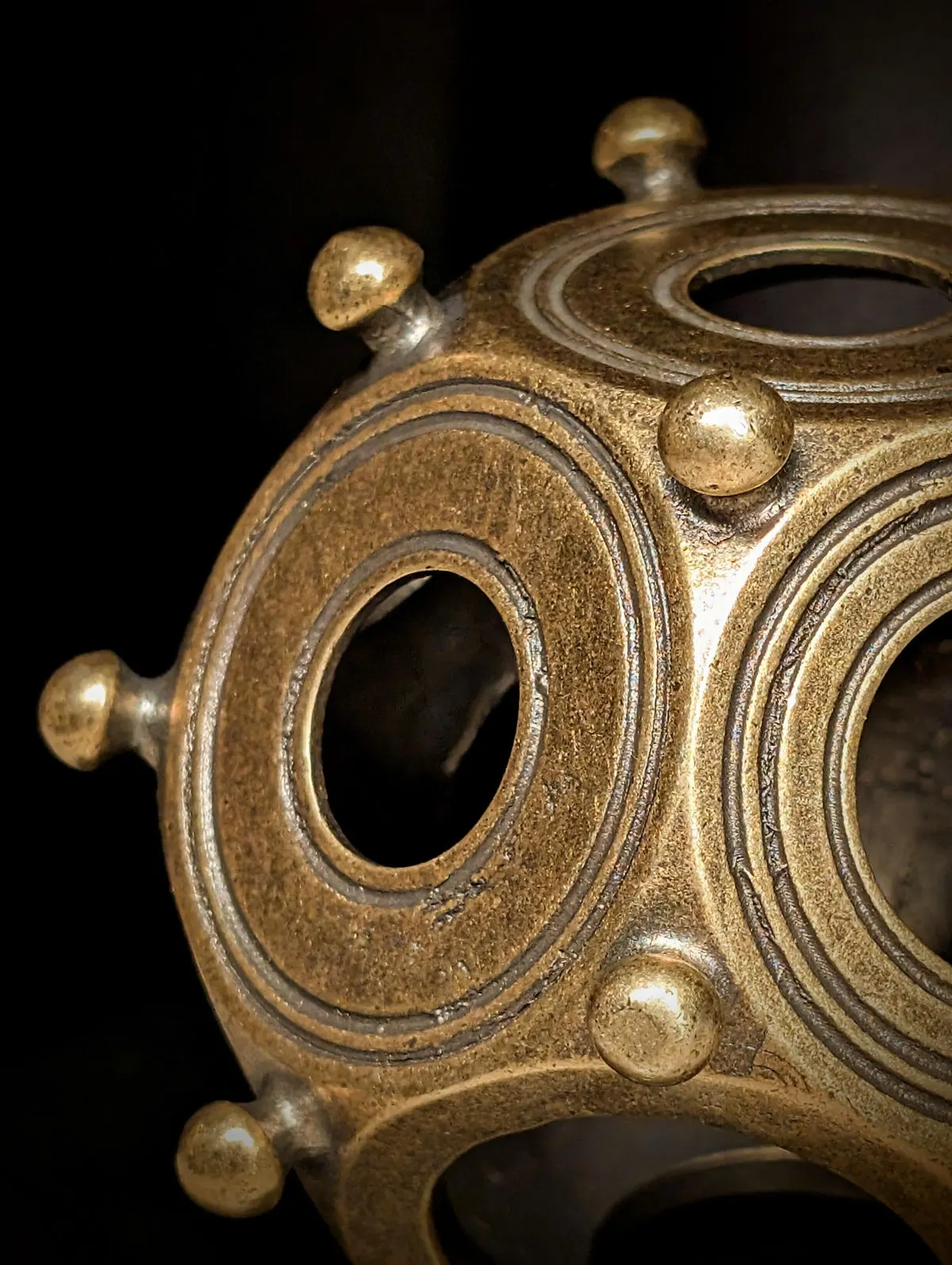 Detail of the knobs and patina on the metal dodecahedron